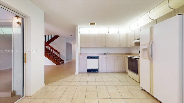 14263 SW 97th Ter, Miami, FL 33186 - kitchen featuring white appliances, light countertops, under cabinet range hood, and light tile patterned flooring