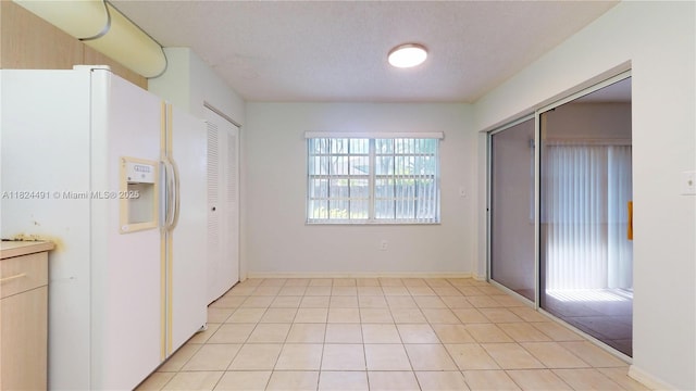 14263 SW 97th Ter, Miami, FL 33186 - unfurnished bedroom with white refrigerator with ice dispenser and a textured ceiling