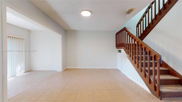 14263 SW 97th Ter, Miami, FL 33186 - stairs with a textured ceiling and tile patterned flooring