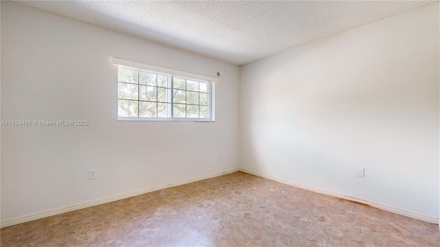 14263 SW 97th Ter, Miami, FL 33186 - spare room with a textured ceiling