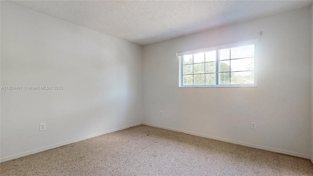 14263 SW 97th Ter, Miami, FL 33186 - spare room with carpet flooring and a textured ceiling