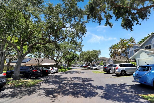 14263 SW 97th Ter, Miami, FL 33186 - view of asphalt road with a residential view