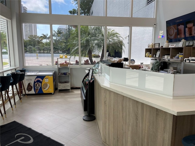 3301 NE 183rd St Unit 2203, Aventura, FL 33160 - kitchen with light tile patterned floors and a high ceiling