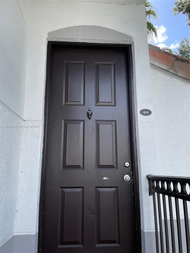 711 SW 148th Ave Unit 414, Sunrise, FL 33325 - doorway to property with stucco siding