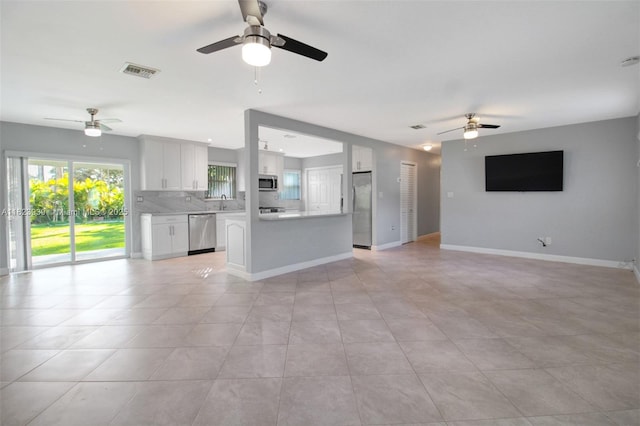 6255 SW 62nd Ct, South Miami, FL 33143 - unfurnished living room with a ceiling fan and light tile patterned floors