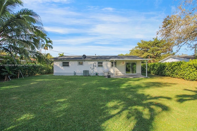 6255 SW 62nd Ct, South Miami, FL 33143 - back of property with a patio, a yard, and stucco siding