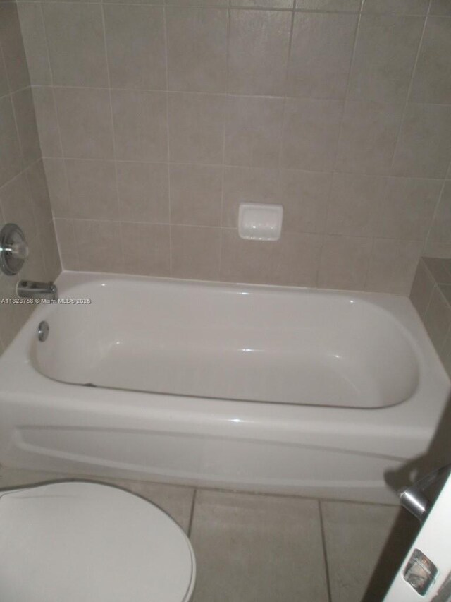 4812 Washington St Unit 8, Hollywood, FL 33021 - full bath featuring vanity, curtained shower, and tile patterned flooring