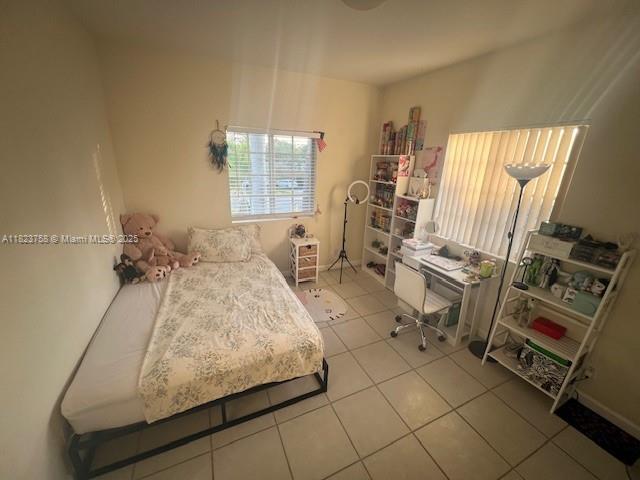 4812 Washington St Unit 8, Hollywood, FL 33021 - bedroom with light tile patterned floors
