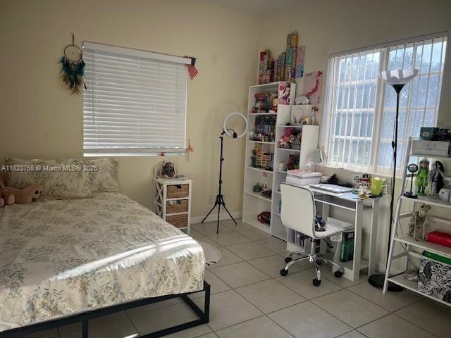 4812 Washington St Unit 8, Hollywood, FL 33021 - bedroom with tile patterned floors and a desk