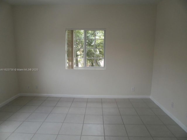 4812 Washington St Unit 8, Hollywood, FL 33021 - spare room with light tile patterned floors and baseboards