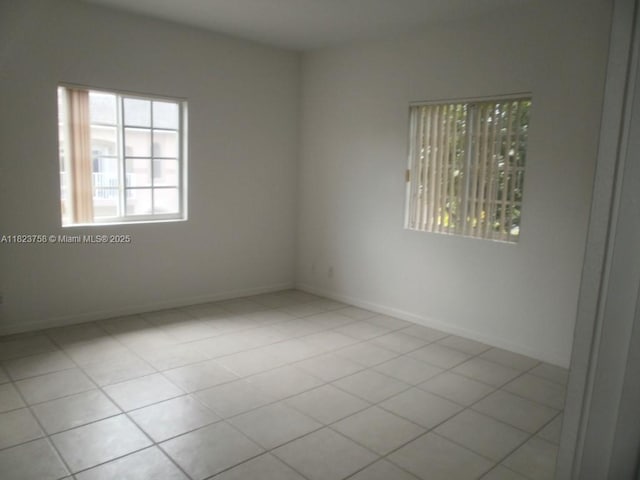 4812 Washington St Unit 8, Hollywood, FL 33021 - tiled spare room with baseboards
