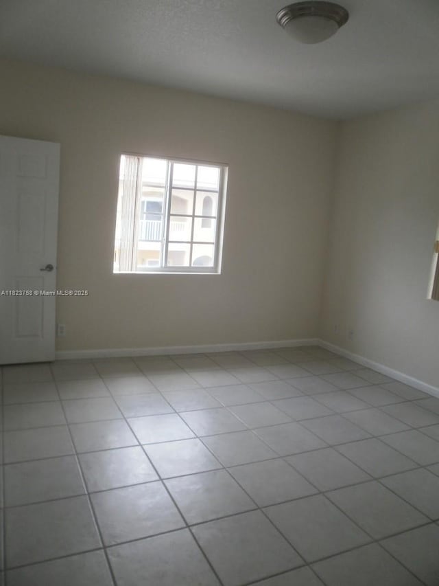 4812 Washington St Unit 8, Hollywood, FL 33021 - unfurnished room with light tile patterned floors and baseboards