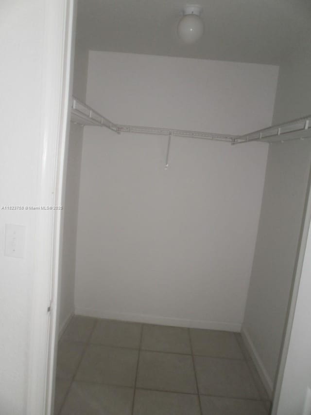 4812 Washington St Unit 8, Hollywood, FL 33021 - spacious closet featuring light tile patterned floors