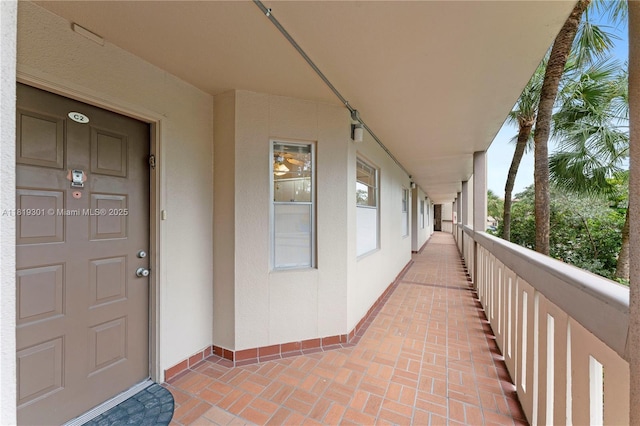 1704 Andros Isle Unit C2, Coconut Creek, FL 33066 - doorway to property with a balcony and stucco siding