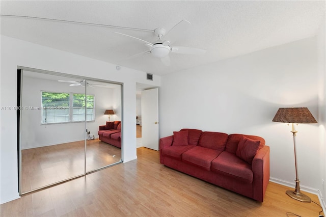 1704 Andros Isle Unit C2, Coconut Creek, FL 33066 - living area with ceiling fan and wood finished floors