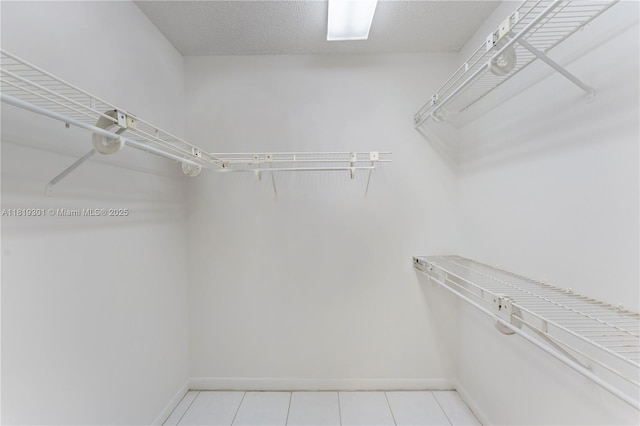 1704 Andros Isle Unit C2, Coconut Creek, FL 33066 - spacious closet featuring light tile patterned floors