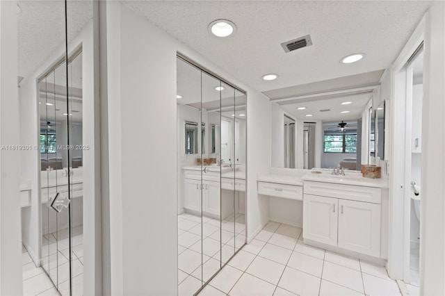 1704 Andros Isle Unit C2, Coconut Creek, FL 33066 - full bath featuring vanity, tile patterned flooring, and recessed lighting