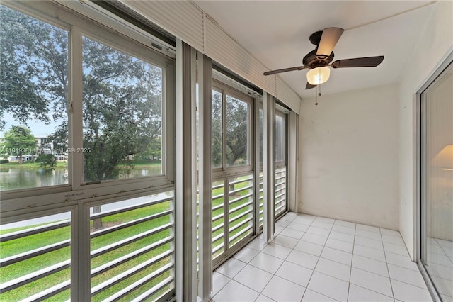 1704 Andros Isle Unit C2, Coconut Creek, FL 33066 - unfurnished sunroom featuring a water view, healthy amount of natural light, and a ceiling fan