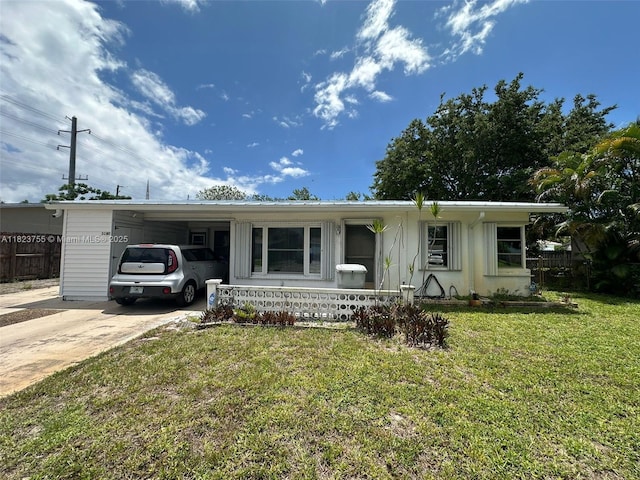 3180 NE 10th Ter, Pompano Beach, FL 33064 - view of front of property featuring concrete driveway and a carport
