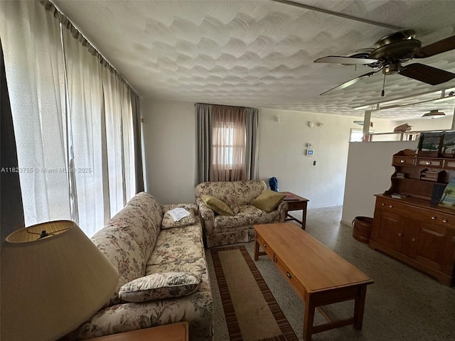 3180 NE 10th Ter, Pompano Beach, FL 33064 - living room featuring plenty of natural light, ceiling fan, and a textured ceiling