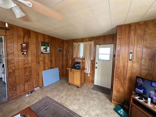3180 NE 10th Ter, Pompano Beach, FL 33064 - foyer entrance with wooden walls and ceiling fan