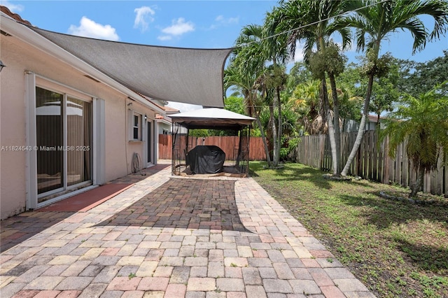 4731 NW 7th Mnr, Coconut Creek, FL 33063 - fenced backyard with a gazebo, a patio, and grilling area