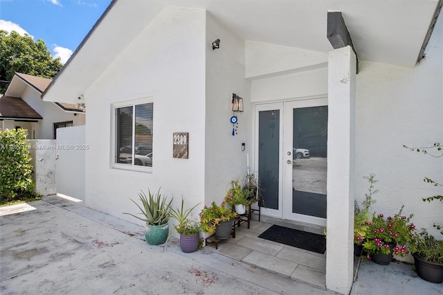 2309 SW 62nd Ct, Miami, FL 33155 - property entrance featuring french doors, stucco siding, and a patio