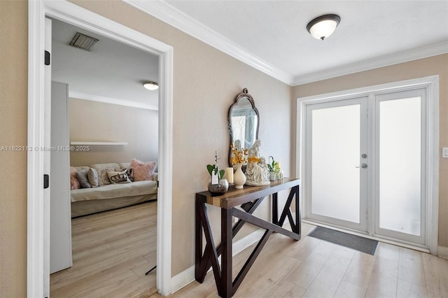 2309 SW 62nd Ct, Miami, FL 33155 - entrance foyer featuring ornamental molding, light wood-style flooring, and healthy amount of natural light