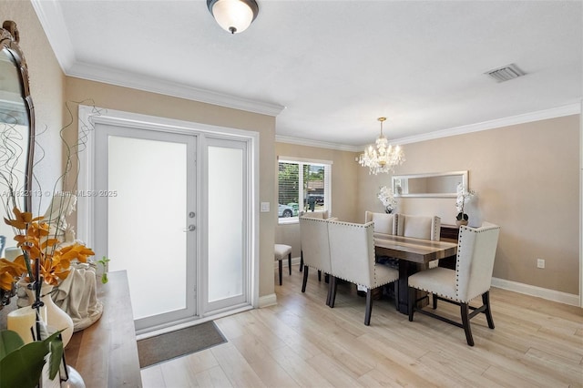 2309 SW 62nd Ct, Miami, FL 33155 - dining space featuring a chandelier, light wood-style floors, and crown molding