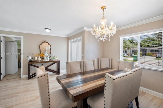 2309 SW 62nd Ct, Miami, FL 33155 - dining space with a chandelier, crown molding, and light wood-style floors