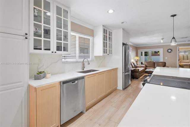 2309 SW 62nd Ct, Miami, FL 33155 - kitchen featuring stainless steel appliances, open floor plan, light brown cabinetry, ornamental molding, and tasteful backsplash