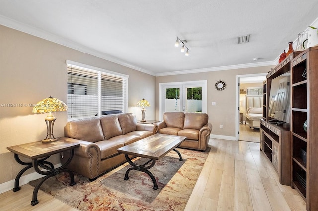2309 SW 62nd Ct, Miami, FL 33155 - living area featuring french doors, ornamental molding, light wood-style floors, and rail lighting