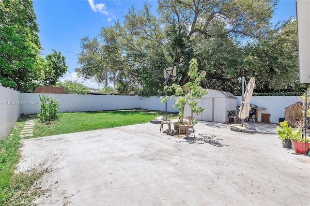 2309 SW 62nd Ct, Miami, FL 33155 - fenced backyard with a storage unit and a patio