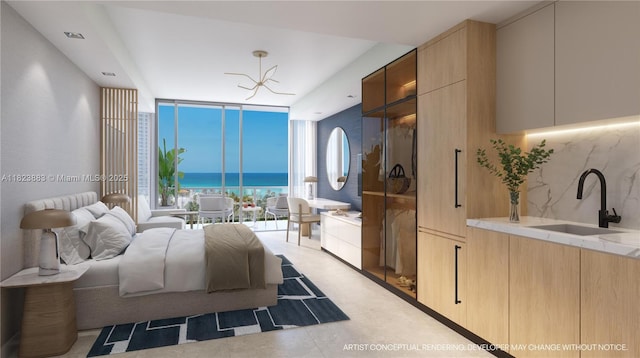 7200 Collins Ave Unit 1113, Miami Beach, FL 33141 - bedroom with a wall of windows, a water view, and a chandelier