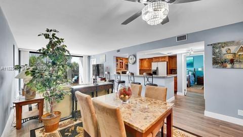 200 Leslie Dr Unit 407, Hallandale Beach, FL 33009 - dining space featuring ceiling fan and light wood-style flooring