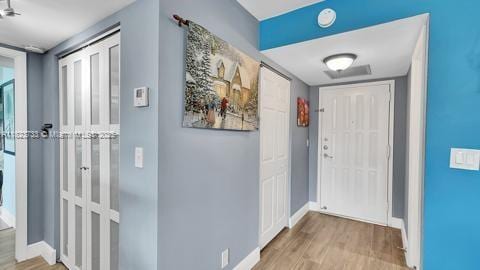 200 Leslie Dr Unit 407, Hallandale Beach, FL 33009 - foyer entrance featuring wood finished floors and baseboards