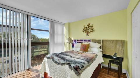 200 Leslie Dr Unit 407, Hallandale Beach, FL 33009 - bedroom featuring wood finished floors and baseboards