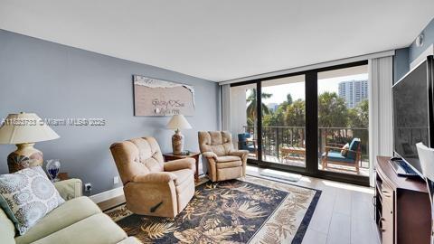 200 Leslie Dr Unit 407, Hallandale Beach, FL 33009 - living area featuring wood finished floors