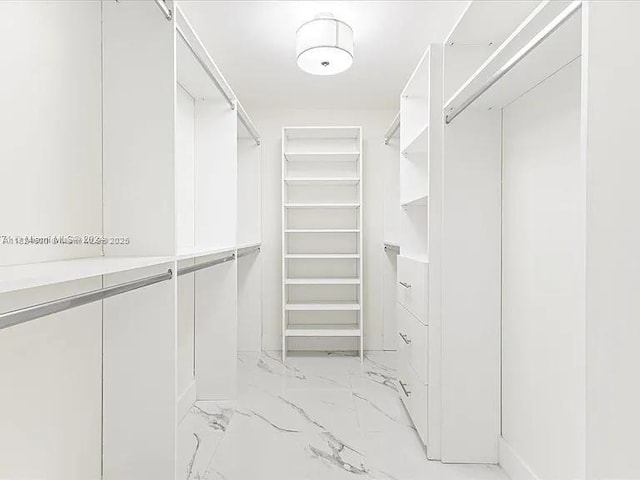 3900 Island Blvd Unit B408, Aventura, FL 33160 - walk in closet with light marble finish flooring