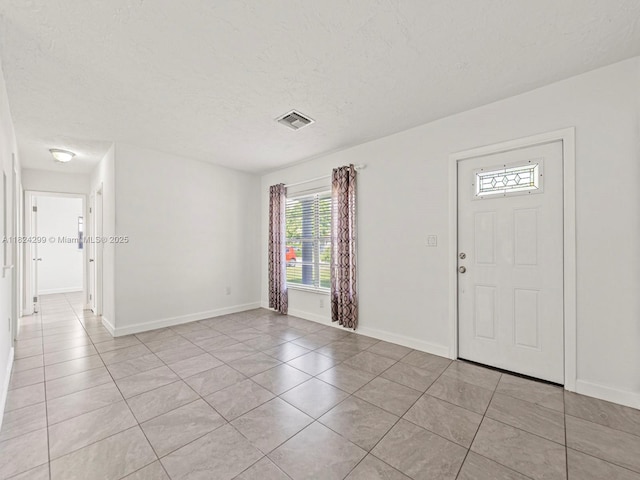 15314 SW 102nd Ct, Miami, FL 33157 - entrance foyer featuring light tile patterned flooring and a textured ceiling
