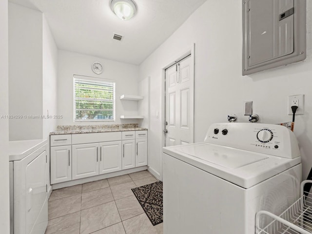 15314 SW 102nd Ct, Miami, FL 33157 - laundry area featuring washer hookup, electric panel, cabinet space, and light tile patterned floors
