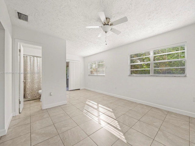 15314 SW 102nd Ct, Miami, FL 33157 - unfurnished room featuring light tile patterned floors, a ceiling fan, and a textured ceiling