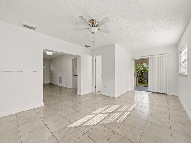 15314 SW 102nd Ct, Miami, FL 33157 - unfurnished room with light tile patterned floors, ceiling fan, and a textured ceiling