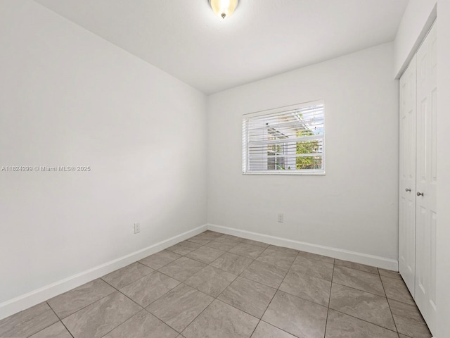 15314 SW 102nd Ct, Miami, FL 33157 - unfurnished bedroom featuring a closet and light tile patterned floors
