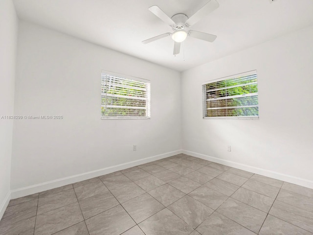 15314 SW 102nd Ct, Miami, FL 33157 - empty room with a ceiling fan and light tile patterned flooring