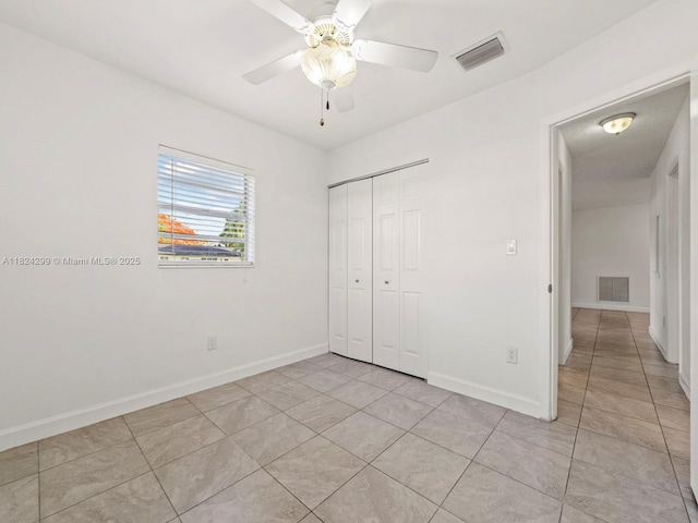 15314 SW 102nd Ct, Miami, FL 33157 - unfurnished bedroom with a closet, light tile patterned floors, and a ceiling fan