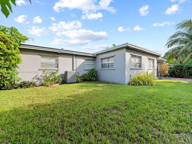 15314 SW 102nd Ct, Miami, FL 33157 - rear view of house featuring stucco siding and a yard