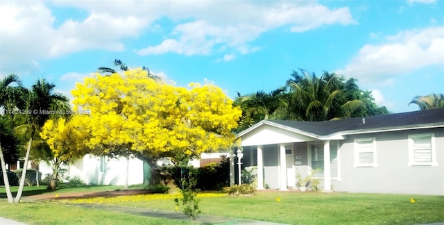 15314 SW 102nd Ct, Miami, FL 33157 - view of front of home featuring a front yard, stucco siding, and a porch