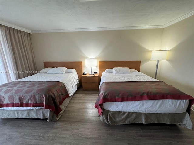 19201 Collins Ave Unit 1137, Sunny Isles Beach, FL 33160 - bedroom featuring ornamental molding and wood finished floors