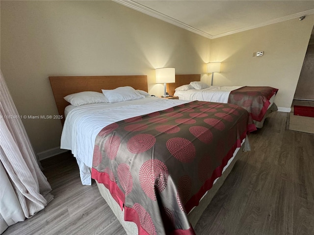 19201 Collins Ave Unit 1137, Sunny Isles Beach, FL 33160 - bedroom featuring wood finished floors and ornamental molding